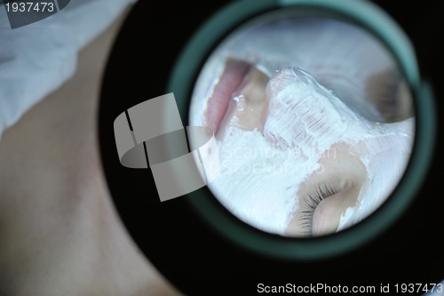 Image of woman with facial mask in cosmetic studio