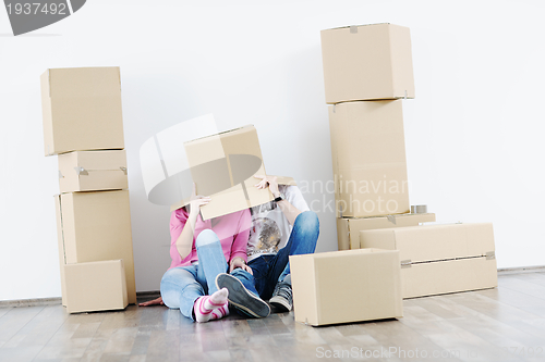 Image of Young couple moving in new house