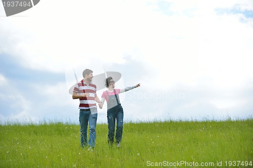 Image of romantic young couple in love together outdoor