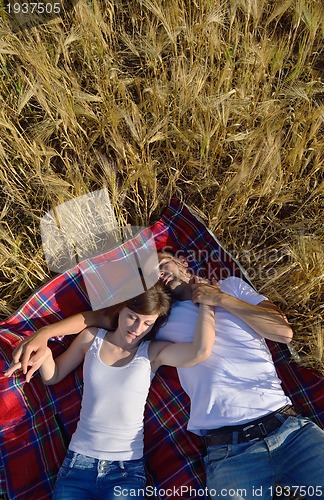 Image of happy couple in wheat field