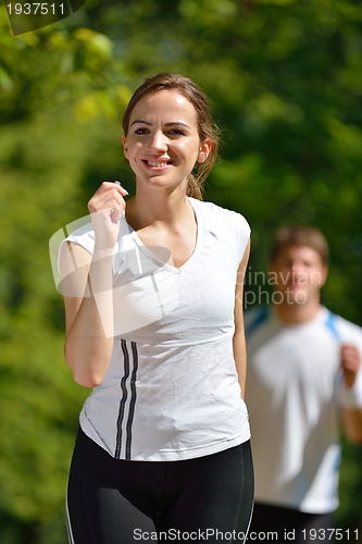 Image of Young couple jogging at morning