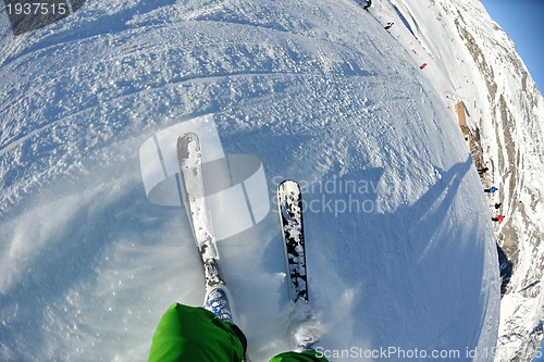 Image of skiing on fresh snow at winter season at beautiful sunny day