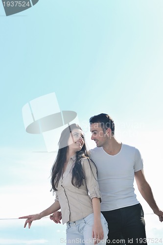 Image of couple relaxing on balcony