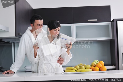 Image of young couple have fun in modern kitchen