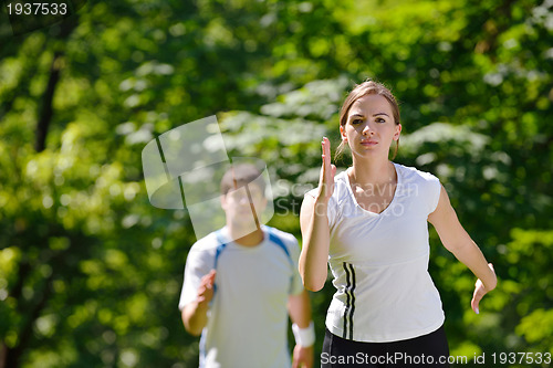 Image of Young couple jogging