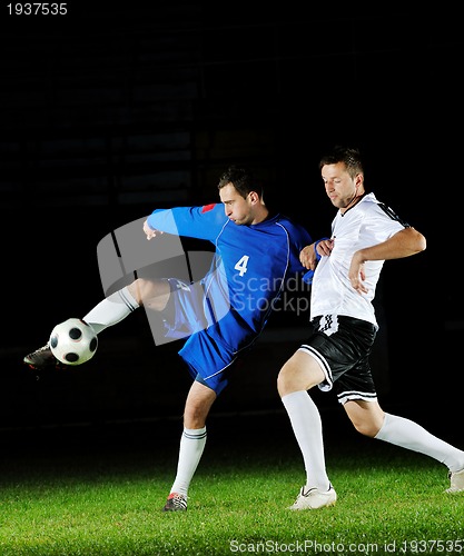 Image of football players in action for the ball