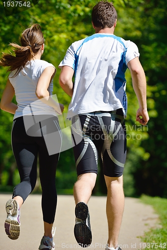 Image of Young couple jogging