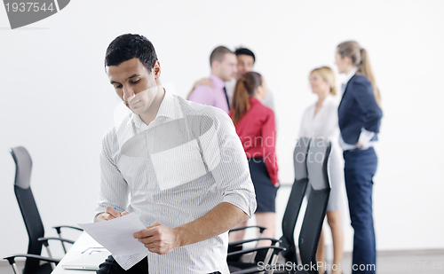 Image of young business man at meeting