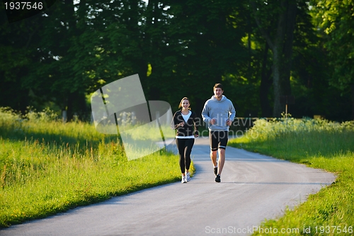 Image of Young couple jogging