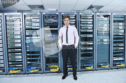 Image of young it engeneer in datacenter server room