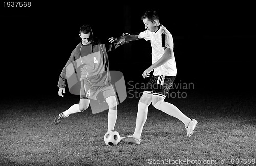 Image of football players in action for the ball