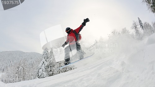 Image of snowboarder on fresh deep snow