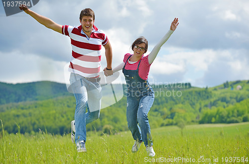 Image of romantic young couple in love together outdoor