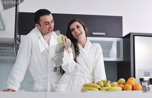 Image of young couple have fun in modern kitchen