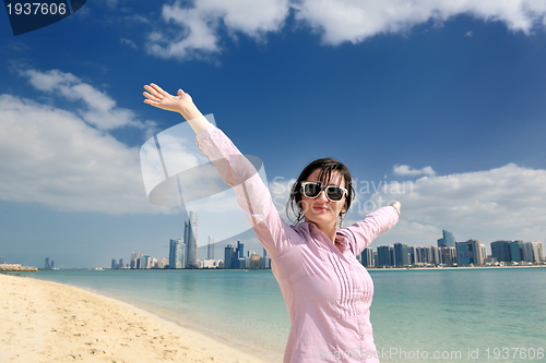 Image of happy tourist woman