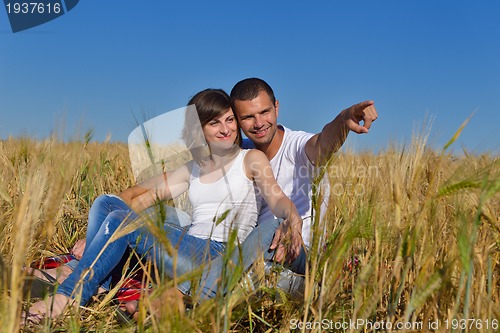 Image of happy couple in wheat field