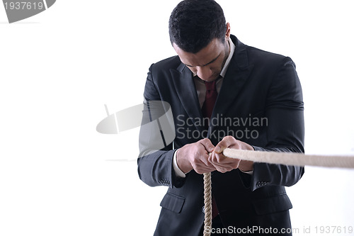 Image of business man with rope isolated on white background