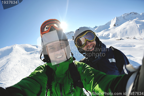 Image of winter portrait of friends at skiing