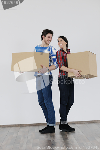 Image of Young couple moving in new home