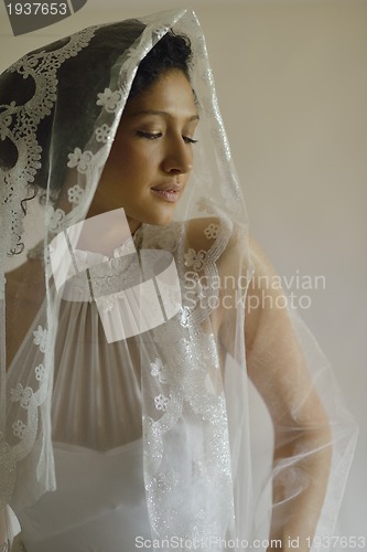 Image of Portrait of a beautiful woman dressed as a bride