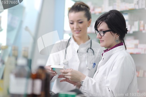 Image of team of pharmacist chemist woman  in pharmacy drugstore