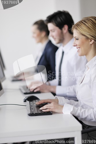 Image of business people group working in customer and help desk office