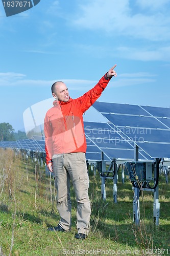 Image of Male solar panel engineer at work place