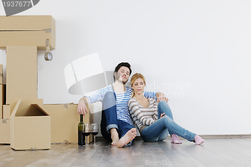 Image of Young couple moving in new house