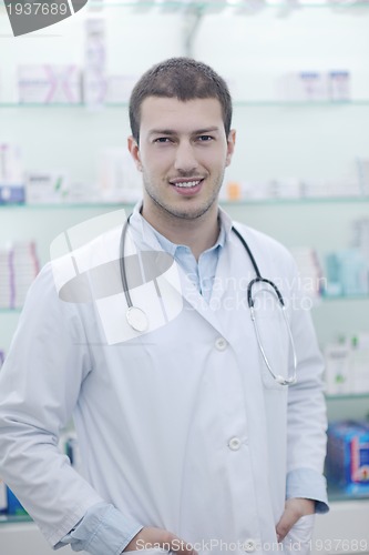 Image of pharmacist chemist man in pharmacy drugstore