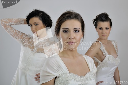 Image of portrait of a three beautiful woman in wedding dress