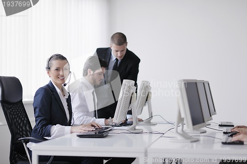 Image of business people group working in customer and help desk office