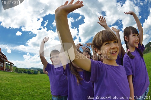Image of happy kids group  have fun in nature