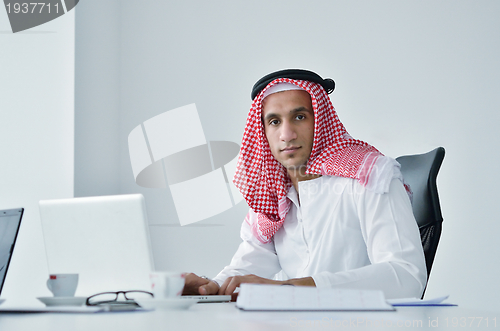 Image of arab business man at bright office