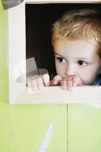 Image of happy child in a window