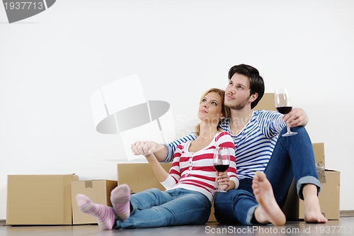 Image of Young couple moving in new house