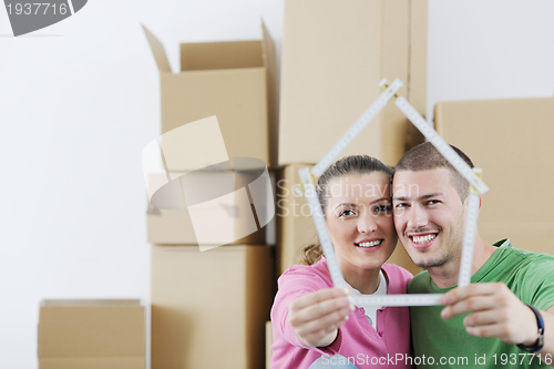 Image of Young couple moving in new house