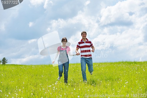 Image of romantic young couple in love together outdoor