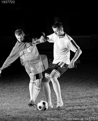 Image of football players in action for the ball