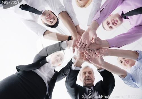 Image of business people group joining hands