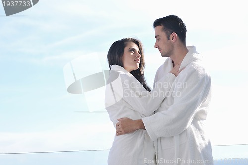 Image of couple relaxing on balcony