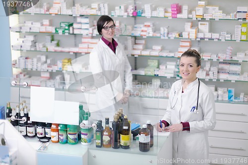 Image of team of pharmacist chemist woman  in pharmacy drugstore