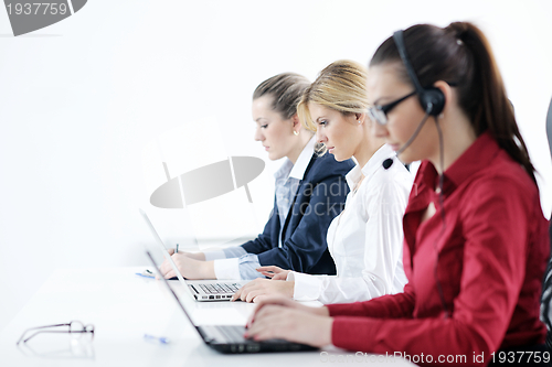 Image of business woman group with headphones