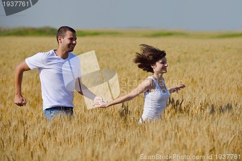Image of happy couple in wheat field