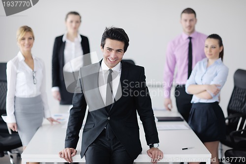 Image of young business man at meeting