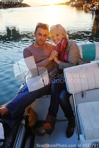 Image of couple in love  have romantic time on boat