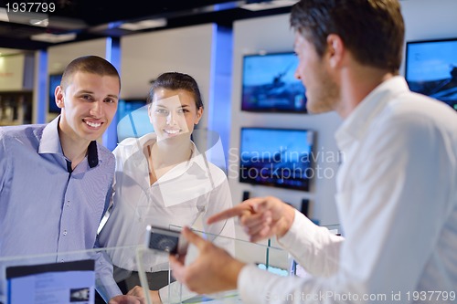 Image of people buy  in consumer electronics store