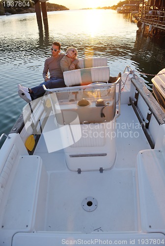 Image of couple in love  have romantic time on boat