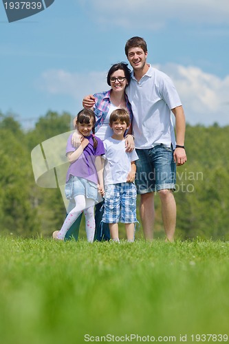 Image of happy young family have fun outdoors