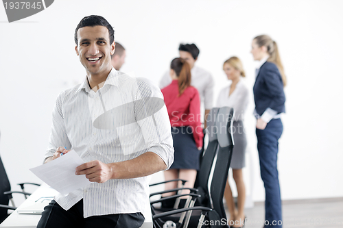 Image of young business man at meeting