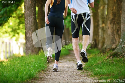 Image of Young couple jogging at morning